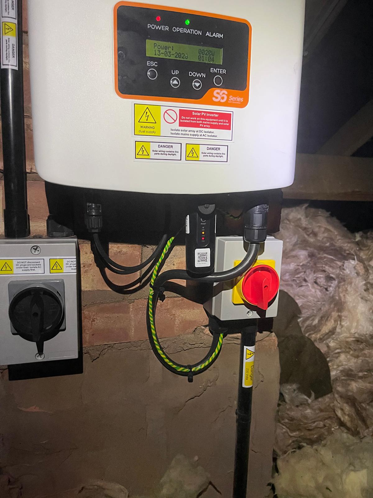 Solar PV inverter installation with DC and AC isolators in a West Midlands loft — S-Series domestic system fitted by ANP Electrical